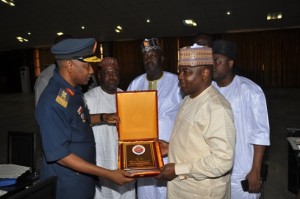 The Comdt AFCSC presenting a plague to the Chairman House committee on Defence