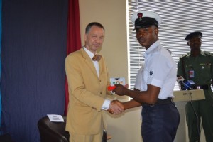 The German Ambassador to Nigeria Dr Bernhard Schlagheck presenting a German Proficiency medals to one of the grandaunt