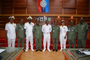 Middle - CDS Rep, Rear Admiral Apochi Suleiman flanked by the newly decorated Senior Officers