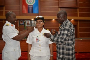 Rear Admiral Habila Ngalakar and Commodore TG Sunday (Rtd) decorating Commander Bolanle Sunday